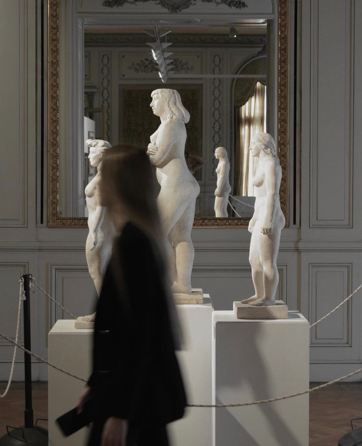 Art gallery with sculptures, evoking Arte di Leyla artistic world