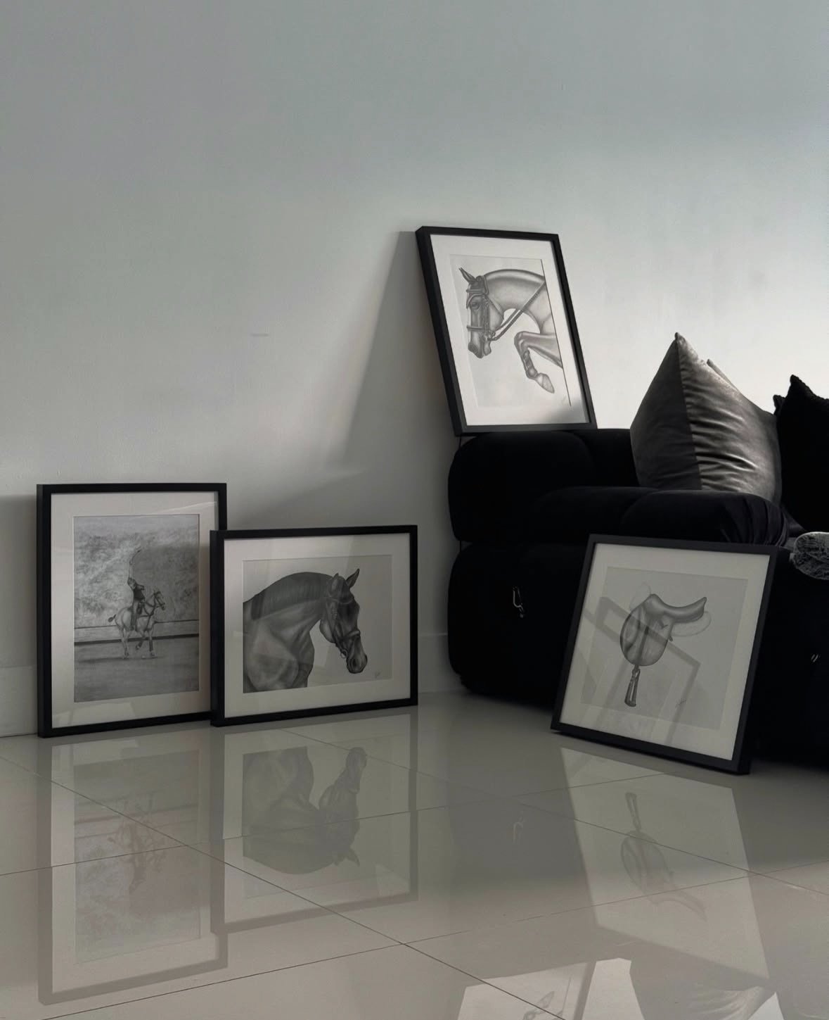 Framed equestrian graphite drawings by Arte di Leyla displayed in a modern living room